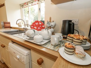 A kitchen with a sink and various kitchenware at Droop Farm Cottage Droop near Hazelbury Bryan