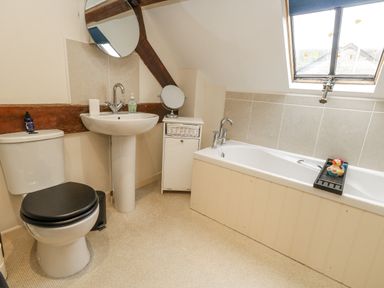 A bathroom with a sink and a toilet at Droop Farm Cottage near Hazelbury Bryan