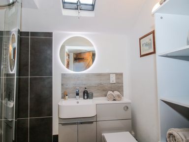 A bathroom with a shower and sink at The Shooting Folly in Cheswardine