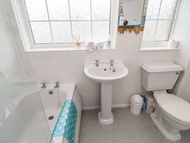 A bathroom with a bathtub a sink and a toilet at The Chace in Portreath