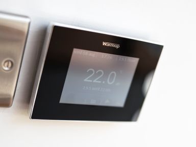 A digital thermostat displaying 22 degrees Celsius on a wall at Teviot Cottage in Corbridge