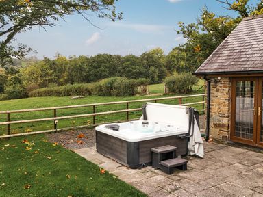 An outdoor area with a hot tub and steps at Ty Berllan in Caersws