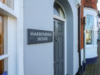 A grey door with number 9 and a Harbourside House sign on a building at Brewers Quay Harbour