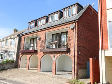 A brick house with balconies and arched carports at Lookout in Cove Castle