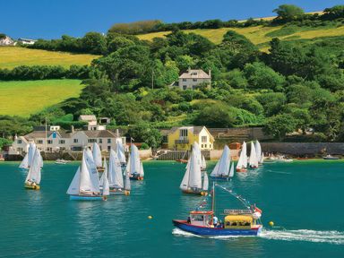A view of sailing boats and houses near water at Estuary View in Kingsbridge