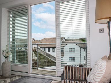 A living room with a view of the outdoors at Estuary View in Kingsbridge