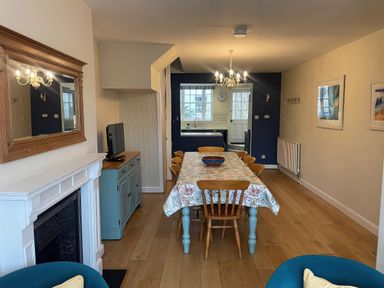 A dining room with a table and chairs at Safe Harbour Brewers Quay harbour