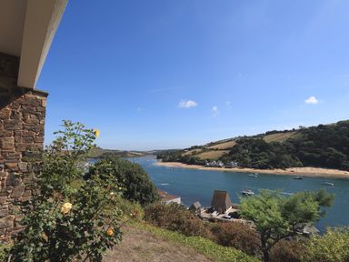 A river with boats and a beach with hills in the background at 2 Poundstone Court in Salcombe
