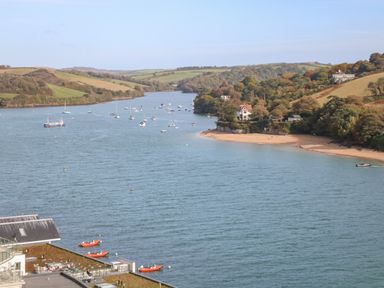 A river with boats and houses along the shore at 2 Poundstone Court in Salcombe