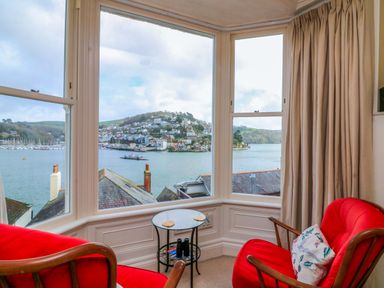 A living room with a view of the water at 3 Dartview in Dartmouth