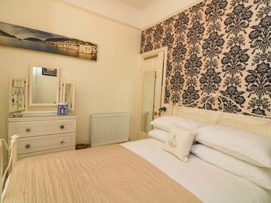 A bedroom with a bed and dresser at 3 Dartview in Dartmouth