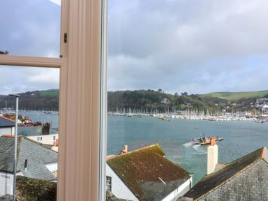 A view of a marina with boats and hills at 3 Dartview in Dartmouth