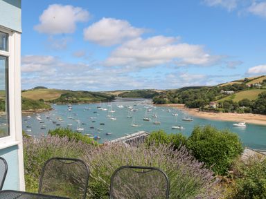 A view of boats on water surrounded by hills at Edinburgh House in Salcombe