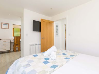 A bedroom with bed, desk and chair at Mellydonen Beder Del (Melly), Tor Down Quarry St Breward