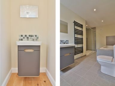 A bathroom with a sink, toilet, bathtub, shower enclosure, and heated towel rail at The Retreat in Lympsham