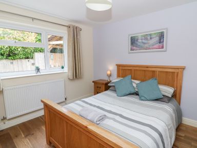 A bedroom with a bed and window at New Peny in Llandrindod Wells