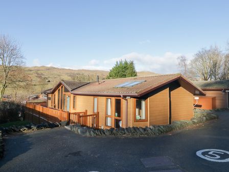 A house with windows and a fence at Heights View in