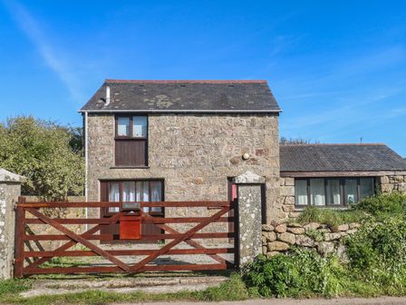 A stone house with a gate at Kernyk in Penzance