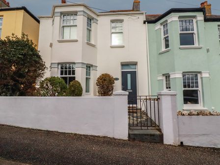 A house with a front door and windows at Beachcomber in Padstow