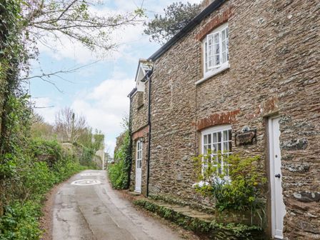 A stone house on a narrow road at Yew Tree Cottage Stoke Fleming