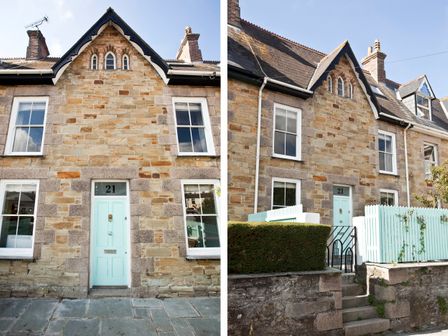 A stone house with a light blue door and white-framed windows at 21 British Road in St Agnes