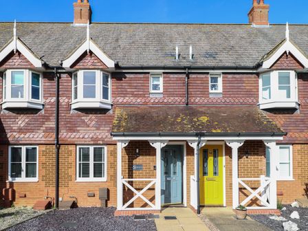A house with blue and yellow doors at 5 Styleman Road Hunstanton