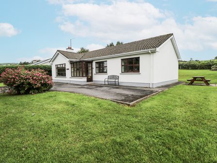 A house with a bench and garden at Brow O' The Hill in Ballyshannon