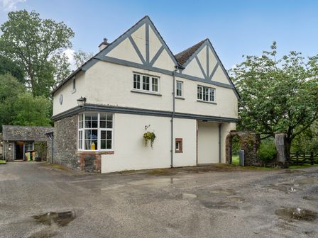 A house with windows and door at Home Farmhouse at the Graythwaite Estate near Hawkshead