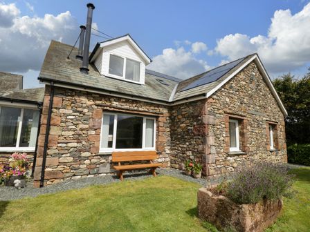 A house with stone walls and a garden at Sherriff, Troutbeck, near Keswick
