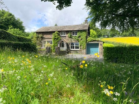 A house with a garage and garden at Hilltop At Hawkshead Hill, Hawkshead