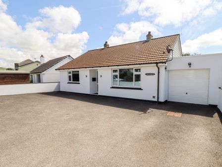A detached bungalow with a tiled roof driveway and attached garage at Summerhayes in Park Bottom
