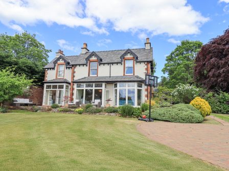 A house with a lawn and garden at Fern Bank in Penrith