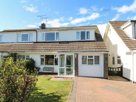 A semi detached house with a tiled roof driveway and front garden at 53 St Brides View Roch