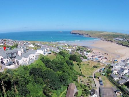 A coastal village with houses and a beach near the sea at The Beach Hut in Polzeath