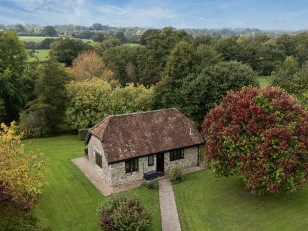 A house with a pathway and trees at The Cider House in Dalwood