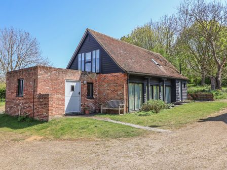 A house with a garden and pathway at The Cart House Sudbourne Near Orford