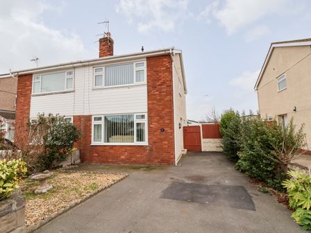 A semi detached house with a driveway and garden at 17 Third Avenue in Prestatyn