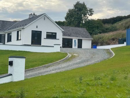 A house with a driveway and lawn at Rockville in Greencastle, County Donegal