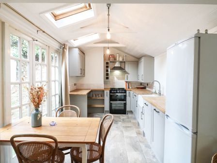 A kitchen with a table and chairs at 5 Prospect Place in Woodbridge
