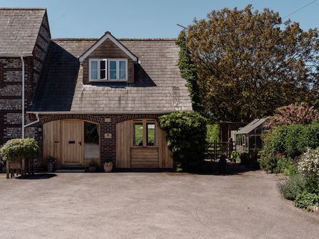 A house with a garden and greenhouse at Tokenhill Cottage Piddletrenthide