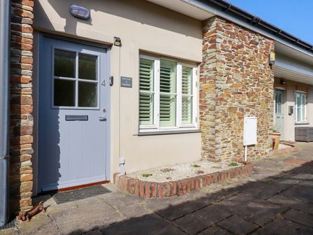 An entrance with a door and window at Pen-Y-Les in Wadebridge