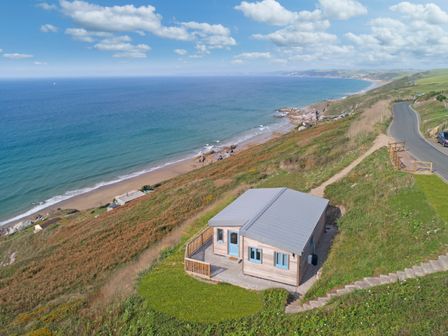 A house on a hillside overlooking the beach and ocean at Solana in Whitsand Bay