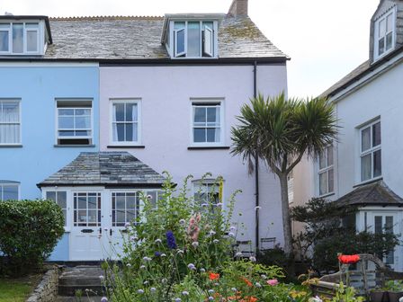 A house with a garden and flowers at 84 Fore Street Port Isaac