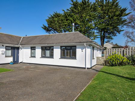 A house with a door and multiple windows at 6 Trelawney Court in Rock