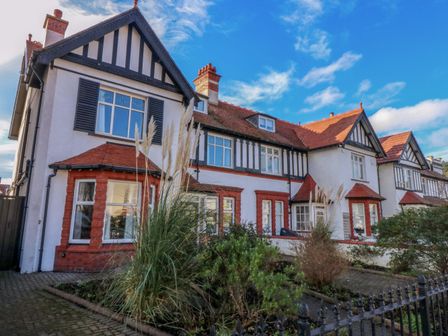 A house with windows and a garden at Southbourne Manor in Llandudno