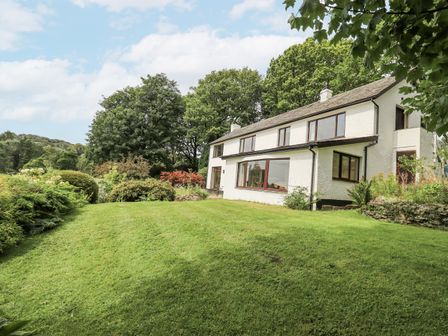 A house with garden and trees at Rowanhill in Kendal