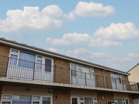 An exterior view of a multi-story building with balconies at Flat 8 Burnham-on-Sea