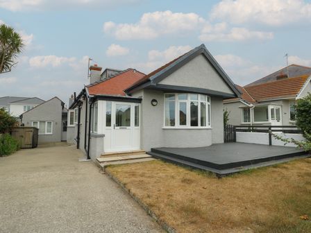 A house with front door and windows on the outdoor area at Gorse Hill 