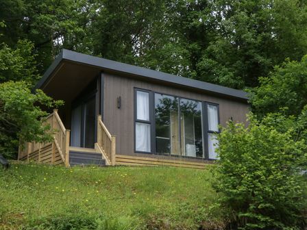 A cabin with steps and windows at Elter Luxury Pod, Keswick