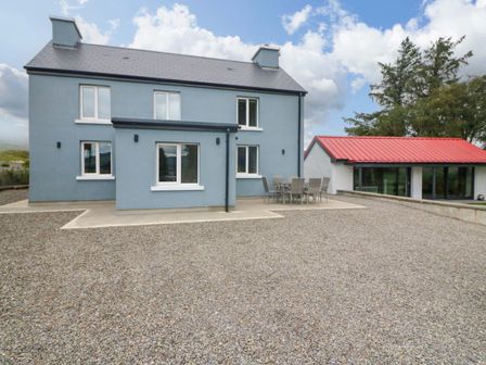A house with a garden and a patio area at Valley View House Kealkill, County Cork